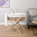 Special Buy - Marshmallow Palm Moses Basket with Stand Bundle in a modern living room by the sofa | Moses Baby Baskets & Bassinets | Nursery Furniture - Clair de Lune