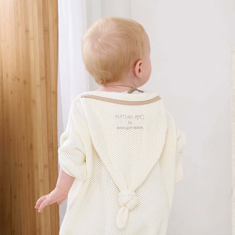 Baby Wearing the Cream Organic Star Breathable Mesh Baby Wrap Blanket | Cosy Baby Blankets and Swaddles | Newborn Summer Essentials - Clair de Lune UK