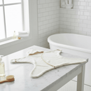 Cream Star Towelling Baby Wrap laid flat in a white bathroom | Bath Time Essentials | Newborn Hooded Towel - Clair de Lune