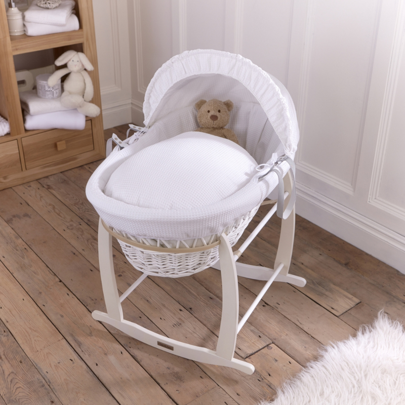 Waffle white wicker moses basket on deluxe white rocking stand in a cottage-core nursery | Moses Baby baskets, bassinets & Co-sleepers | Nursery Furniture - Clair de Lune UK