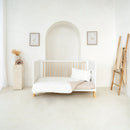Reversible Little Duckling Cot Bed Duvet Cover and Pillowcase Set on the Essentials Cot Bed in a white minimalist nursery | Toddler and Baby Bedding | Nursery Linen - Clair de Lune UK