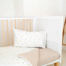 Close up on the Reversible Little Duckling Cot Bed Duvet Cover and Pillowcase Set on the Essentials Cot Bed in a white minimalist nursery | Toddler and Baby Bedding | Nursery Linen - Clair de Lune UK