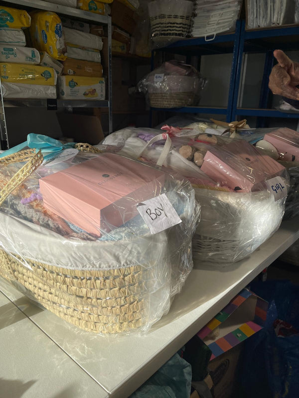 Finished newborn moses basket starter packs ready to give to families in need | Charity Partnerships - Clair de Lune UK