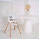 The White 6in1 High Chair in an ultra-stylish white kitchen next to a marble white dining table | High chairs | Feeding & Weaning | Toddler Furniture - Clair de Lune UK