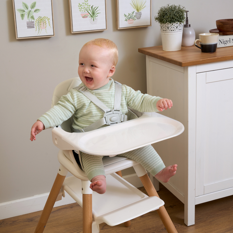 Baby boy with red hair sitting in the White 6in1 High Chair by the sideboard in a farmhouse style kitchen | High chairs | Feeding & Weaning | Toddler Furniture - Clair de Lune UK