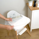 Parent removing the feeding tray from the White 6 in 1 High Chair in a farmhouse style kitchen | High chairs | Feeding & Weaning | Toddler Furniture - Clair de Lune UK