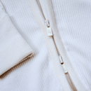 Close up of the zip on the White Grow Grows Organic Ribbed Baby Sleepsuit | Baby Sleep Wear | Children's pyjamas - Clair de Lune UK