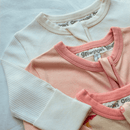 Close up of the soft fabric on the GrowGrows White Ribbed Sleepsuit - Clair de Lune UK