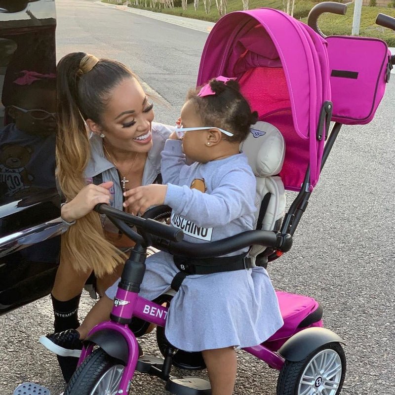 Mum talking to her daughter who is sitting on the Fuchsia Pink Bentley 6in1 Trike - Convertible Baby Stroller | Strollers, Pushchairs & Prams | Pushchairs, Carrycots & Car Seats Baby | Travel Essentials - Clair de Lune UK