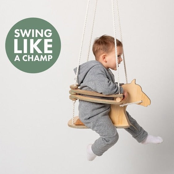 Little boy riding like a champ on the Goodevas Montessori Horse Rope Swing | Montessori Activities For Babies & Kids - Clair de Lune UK