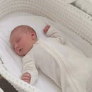 Mum lifting her newborn out of the White Crochet Moses Basket | Moses Baby Baskets and Bassinets - Clair de Lune UK