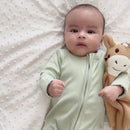 Newborn wearing the Sage Grow Grows Organic Ribbed Baby Sleepsuit and cuddling with the giraffe Organic Comforter | Baby Sleep Wear | Children's pyjamas - Clair de Lune UK