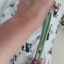Close up of baby wearing the Grow Grows Organic Playful Pandas Sleepsuit | Baby Grows and Onesies | Organic Baby Clothes - Clair de Lune UK