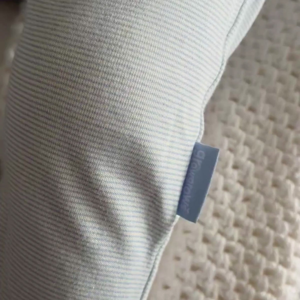 Toddler asleep wearing the Blue Grow Grows Organic Pinstripe Sleepsuit close up on the fabric | Baby Grows and Onesies | Organic Baby Clothes - Clair de Lune UK