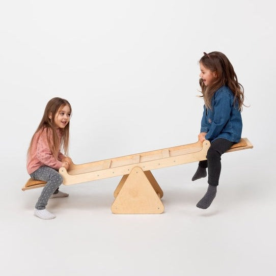 Two little girls having fun playing the Goodevas Montessori Wooden Seesaw | Montessori Activities For Babies & Kids - Clair de Lune UK