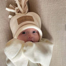 Infant bundled in soft fleece wrap baby blanket for a winter walk | Cosy Baby Blankets | Swaddle Blanket | Nursery Bedding - Clair de Lune UK