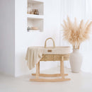 Organic Knitted Palm Moses Basket With Stand and Bedding Bundle in a minimalist and luxury living room nursery | Moses Baby Baskets & Bassinets | Nursery Furniture - Clair de Lune UK