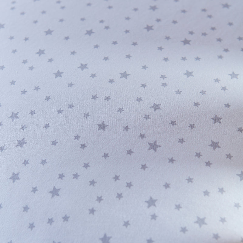The grey star-print fabrics of the Grey Stars & Stripes Nursing Pillow | Pregnancy & Feeding Pillows - Clair de Lune UK