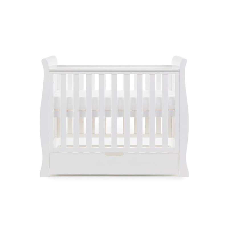 The white space-saving cot as a crib with mattress and a matching under drawer from the white Obaby Stamford Space Saver Cot & Changing Unit | Nursery Furniture Sets | Room Sets | Nursery Furniture - Clair de Lune UK