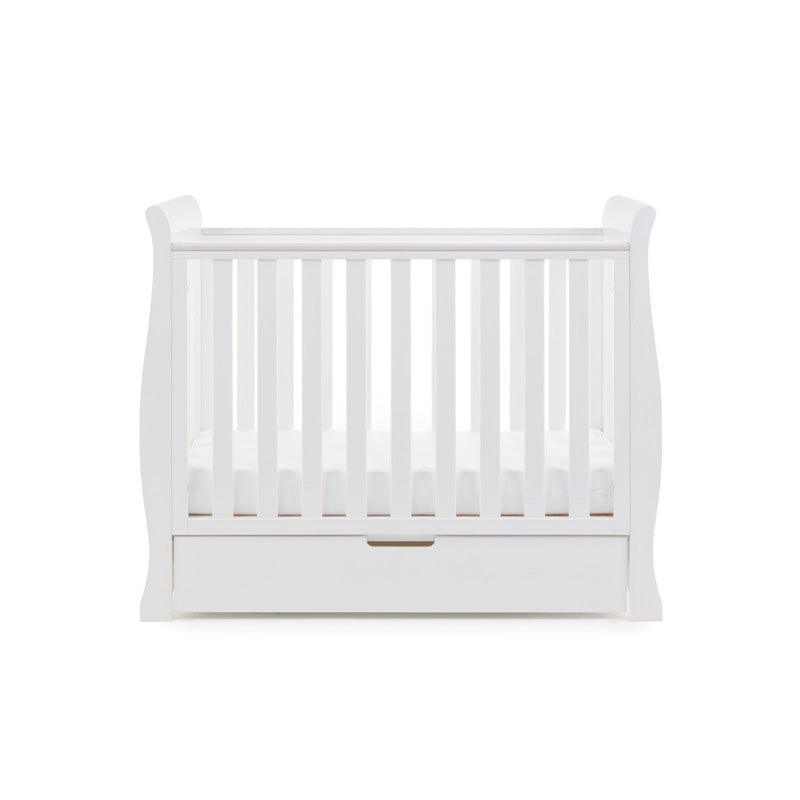 The white space-saving cot with an under drawer from the white Obaby Stamford Space Saver Cot & Changing Unit | Nursery Furniture Sets | Room Sets | Nursery Furniture - Clair de Lune UK