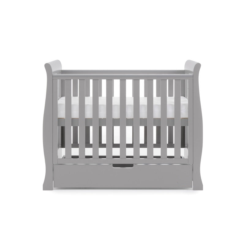 The warm grey space-saving cot as a crib with mattress and under drawer from the warm grey Obaby Stamford Space Saver Cot & Changing Unit | Nursery Furniture Sets | Room Sets | Nursery Furniture - Clair de Lune UK