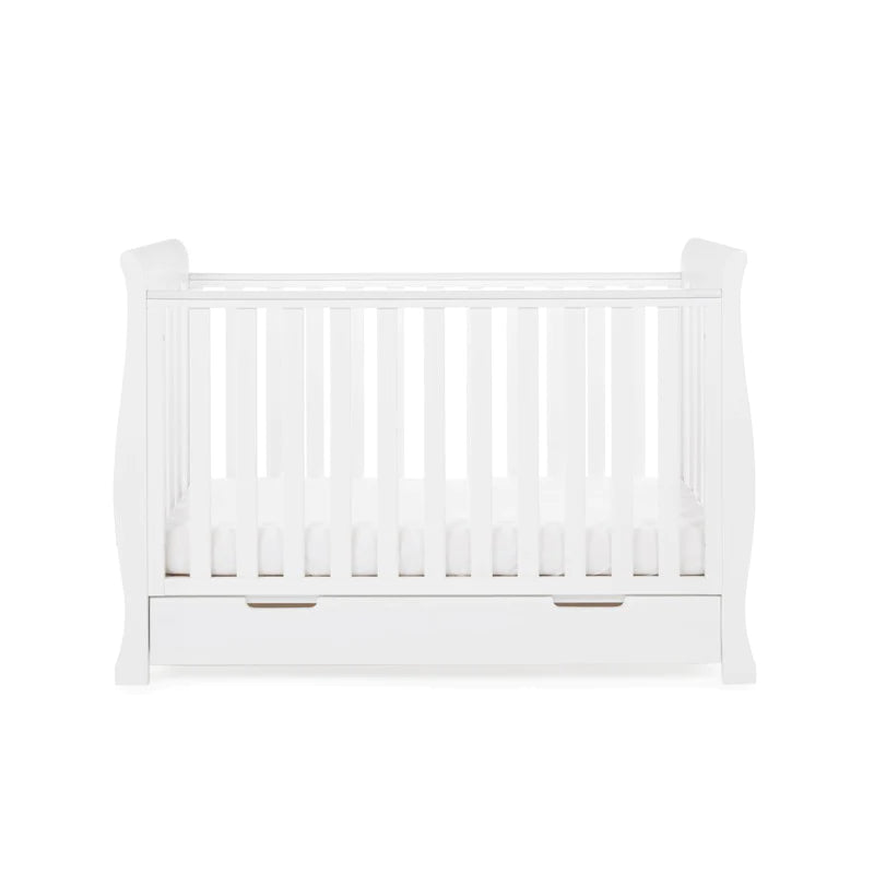 The cot bed of the White Obaby Stamford Mini 3 Piece Room Set with the adjustable platform on the lowest level | Nursery Furniture Sets | Room Sets | Nursery Furniture - Clair de Lune UK