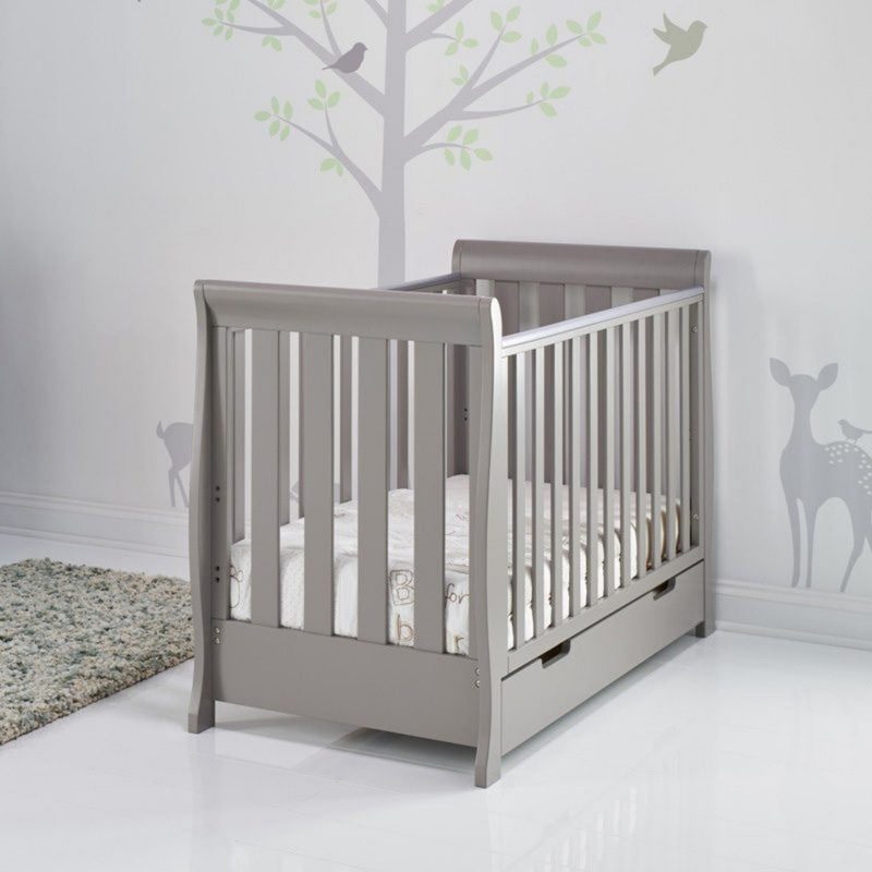 The taupe grey Obaby Stamford Mini Sleigh Cot Bed in a gender neutral nursery room | Cots, Cot Beds, Toddler & Kid Beds | Nursery Furniture - Clair de Lune UK