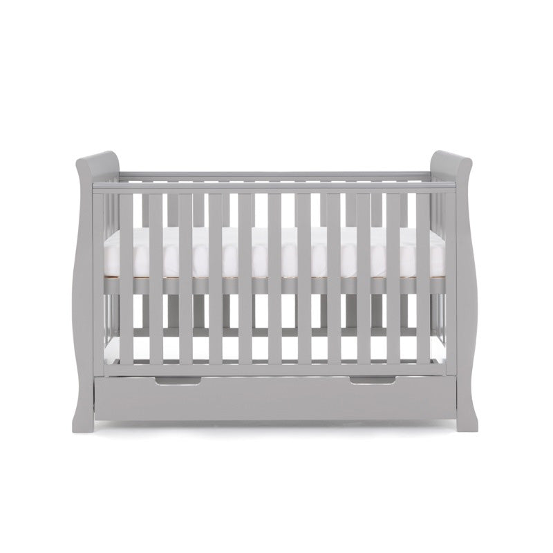 The warm grey Obaby Stamford Mini Sleigh Cot Bed as a crib | Cots, Cot Beds, Toddler & Kid Beds | Nursery Furniture - Clair de Lune UK