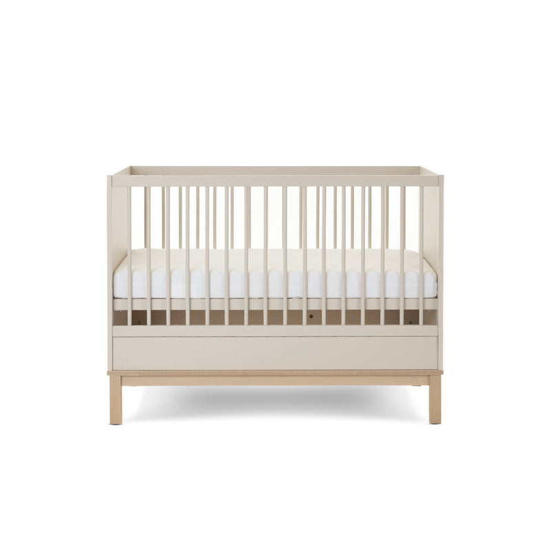 The Cashmere Natural Obaby Astrid Mini Cot Bed with an adjustable platform at a medium level | Cots, Cot Beds, Toddler & Kid Beds | Nursery Furniture - Clair de Lune UK