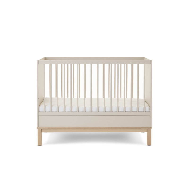The cot bed of the Natural Cashmere Obaby Astrid Mini 2 Piece Room Set with an adjustable platform at the lowest level | Nursery Furniture Sets | Room Sets | Nursery Furniture - Clair de Lune UK