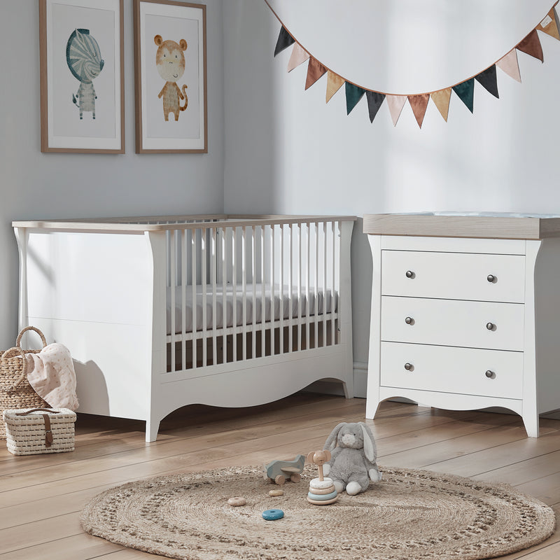  White and Ash CuddleCo Clara 2pc Nursery Set - 3 Drawer Dresser/Changer & Cot Bed in a light grey nursery | Nursery Furniture Sets | Room Sets | Nursery Furniture - Clair de Lune UK