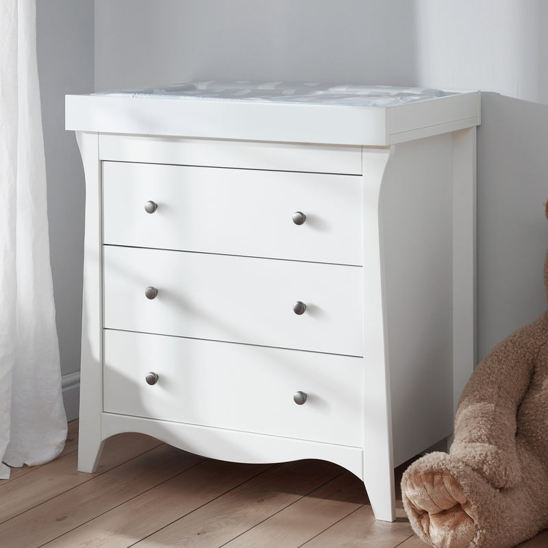 The dresser/ changer of the White CuddleCo Clara 2pc Nursery Set - 3 Drawer Dresser/Changer & Cot Bed | Nursery Furniture Sets | Room Sets | Nursery Furniture - Clair de Lune UK