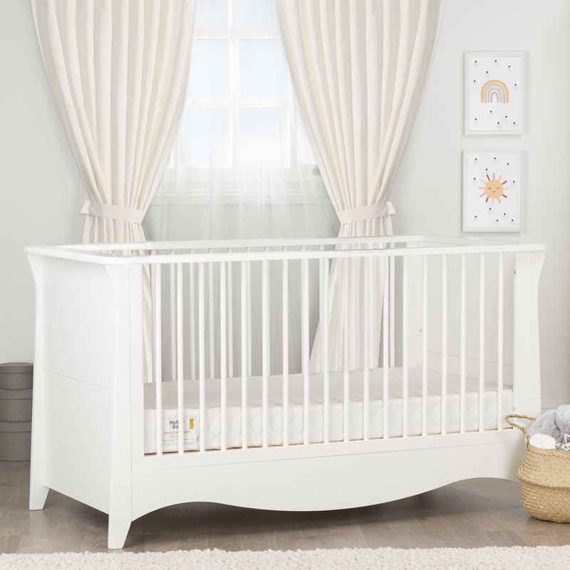 The cot bed of the White CuddleCo Clara 2pc Nursery Set - 3 Drawer Dresser/Changer & Cot Bed | Nursery Furniture Sets | Room Sets | Nursery Furniture - Clair de Lune UK