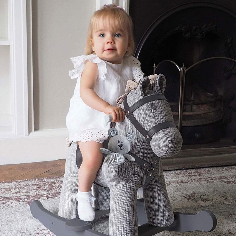 Little girl enjoying her time with the Little Bird Told Me Stirling & Mac Rocking Horse | Rocking Animals | Montessori Activities For Babies & Kids | Toys | Baby Shower, Birthday & Christmas - Clair de Lune UK