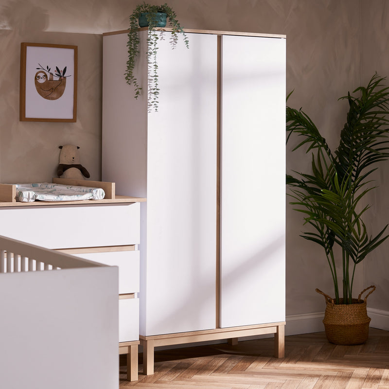 The wardrobe of the White and Natural Obaby Astrid Mini 3 Piece Room Set in a Scandi Cashmere nursery room | Nursery Furniture Sets | Room Sets | Nursery Furniture - Clair de Lune UK