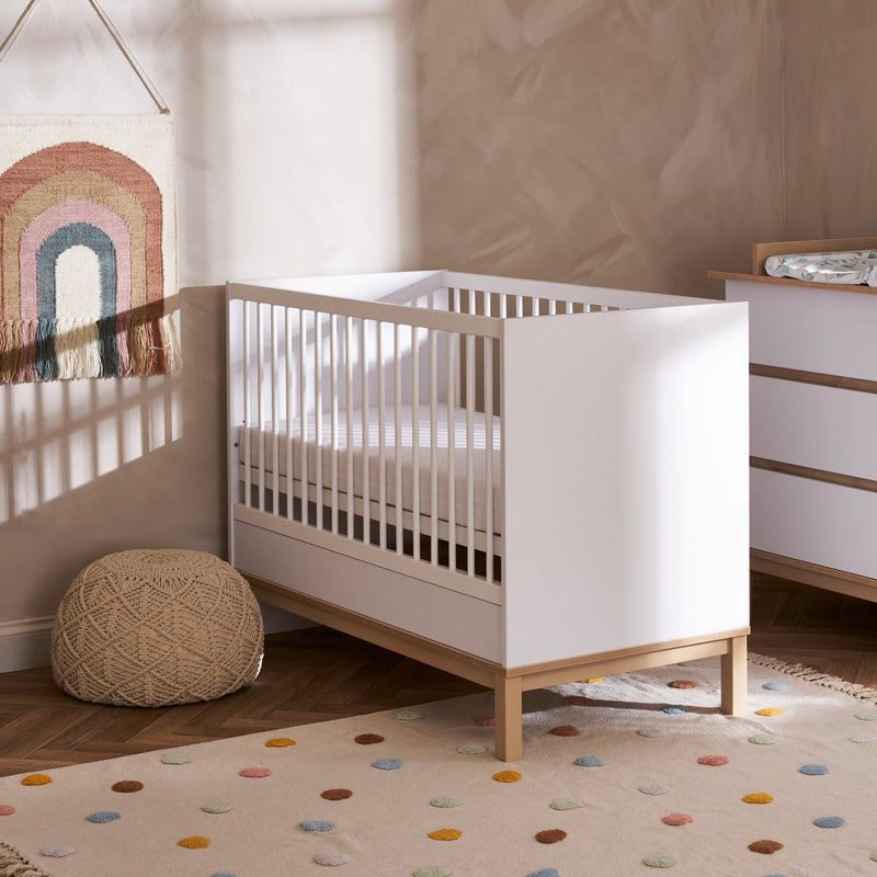 The cot bed of the White and Natural Obaby Astrid Mini 3 Piece Room Set in a Scandi Cashmere nursery room | Nursery Furniture Sets | Room Sets | Nursery Furniture - Clair de Lune UK