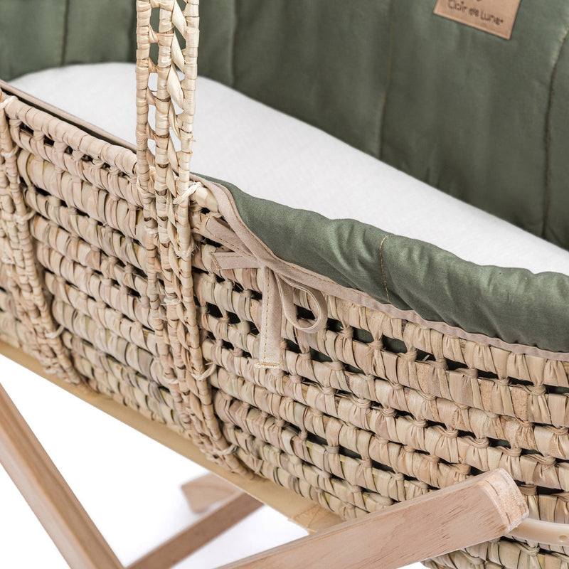 Organic Palm Moses Basket in Forest Green Bundle showing what's included in the bundle: basket, green organic dressing, mattress and stand | Moses Baskets | Co-sleepers | Nursery Furniture - Clair de Lune UK