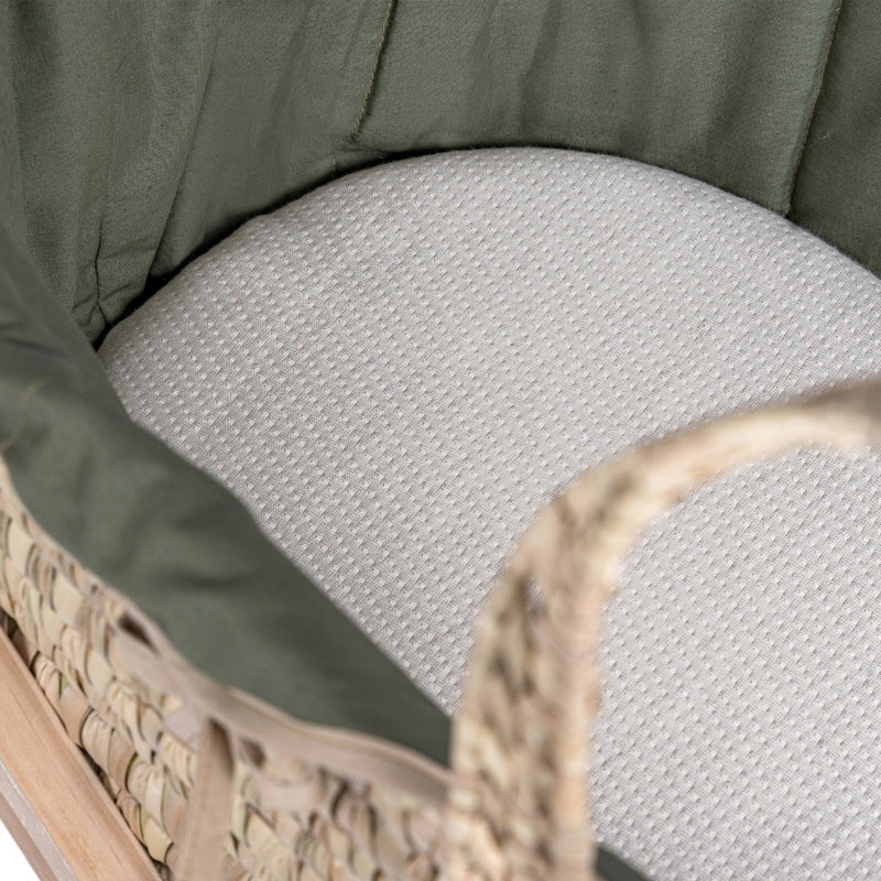 Organic Palm Moses Basket in Forest Green with the mattress and green dressing zoomed in | Moses Baskets | Co-sleepers | Nursery Furniture - Clair de Lune UK