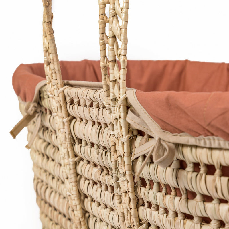 Organic Palm Moses Basket in Rust Orange with the palm handle and basket zoomed in | Moses Baskets | Co-sleepers | Nursery Furniture - Clair de Lune UK
