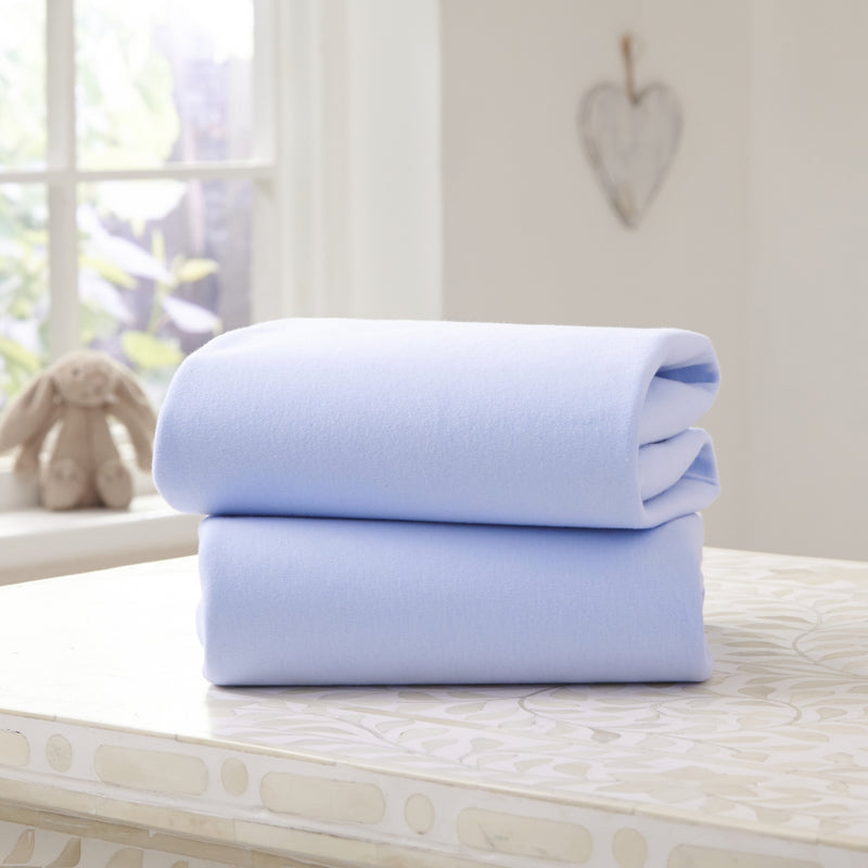 2 Pack Blue Cotton Fitted Pram/Crib Sheets - 90 x 40 cm on a counter top | Soft Baby Sheets | Cot, Cot Bed, Pram, Crib & Moses Basket Bedding - Clair de Lune UK