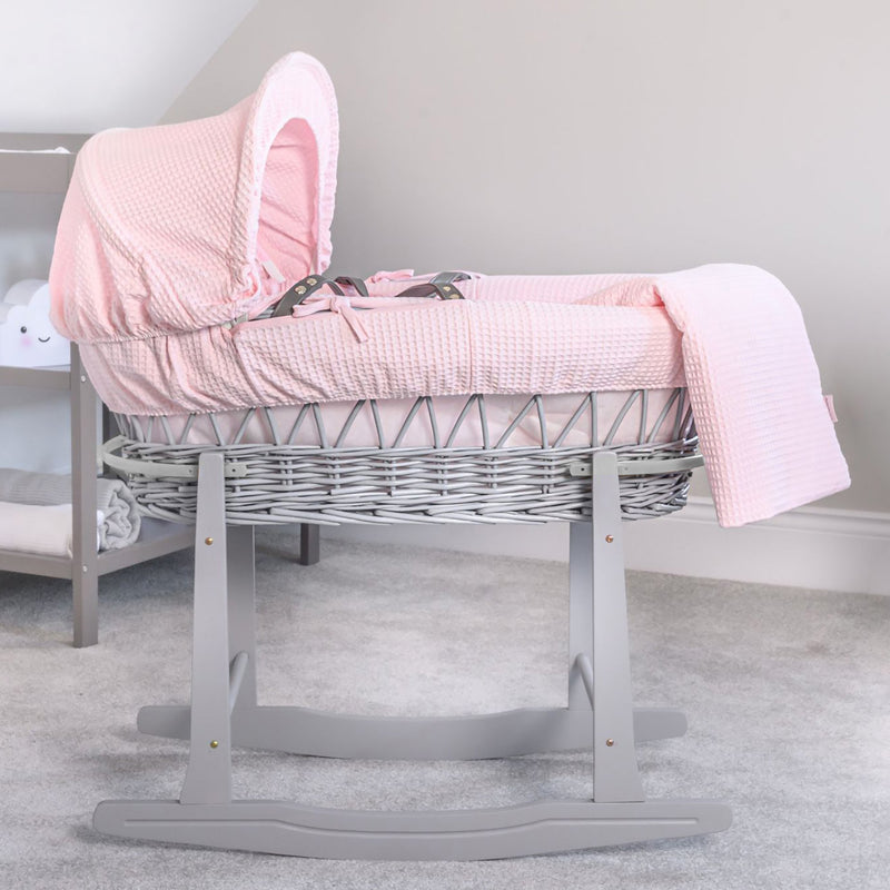 Pink Waffle Grey Wicker Moses Basket on the Grey Deluxe Rocking Stand in a minimalist nursery | Co-sleepers | Nursery Furniture - Clair de Lune UK