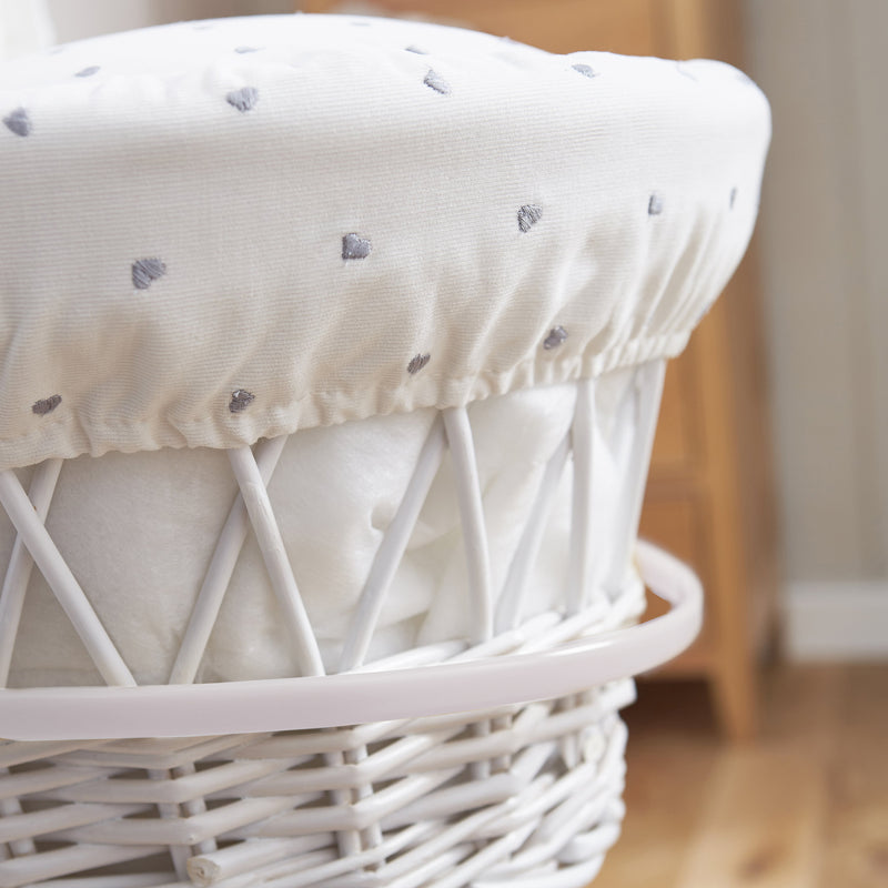 The embroidered hearts fabrics on the Lullaby Hearts White Wicker Moses Basket | Moses Baskets | Co-sleepers | Nursery Furniture - Clair de Lune UK