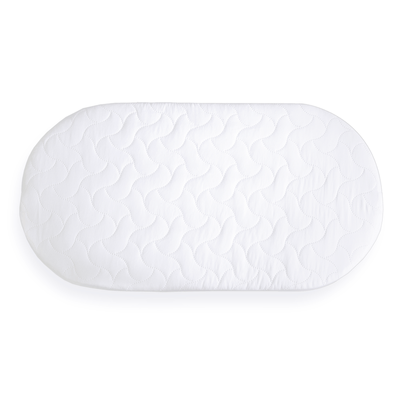 The oval shape of the Quilted Microfibre Bedside Crib Mattress (76 x 40 cm) | Bedside & Folding Crib Mattresses | Baby Mattresses | Bedding | Nursery Furniture - Clair de Lune UK