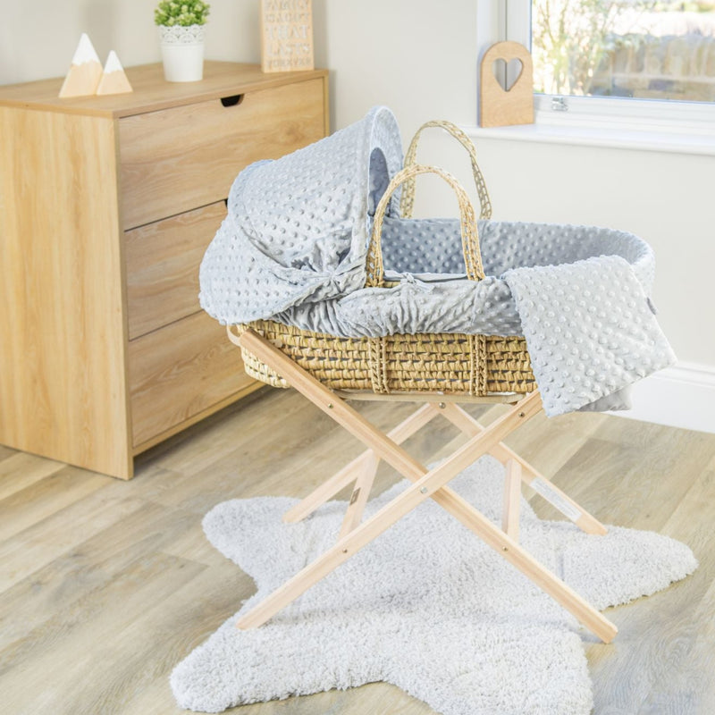 Grey Dimple Palm Moses Basket on the Natural Compact Folding Stand in a minimalist bedroom | Moses Baskets and Stands | Co-sleepers | Nursery Furniture - Clair de Lune UK