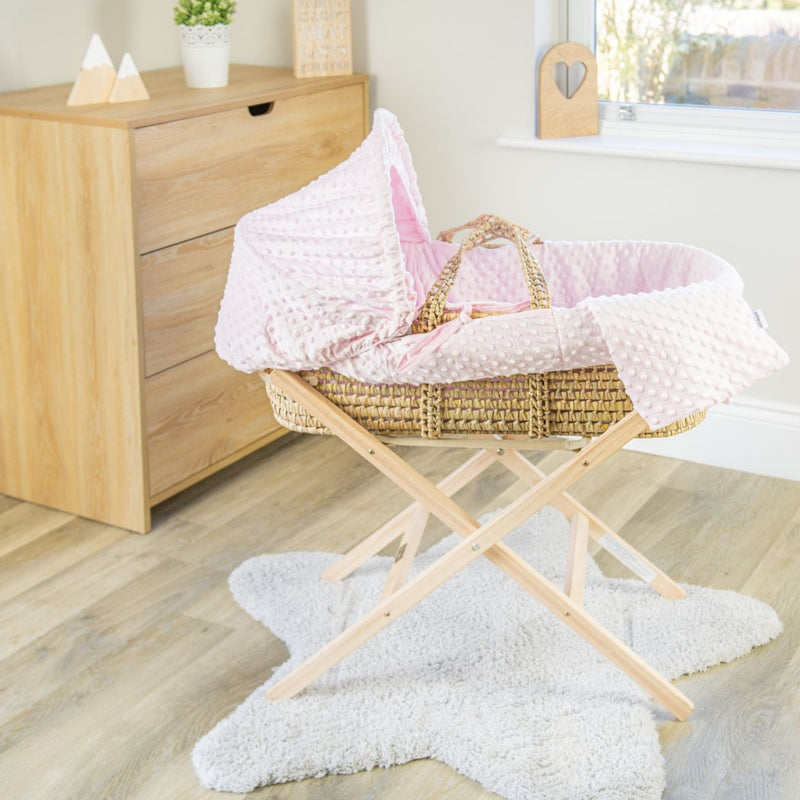 Pink Dimple Palm Moses Basket on the Natural Compact Folding Stand in a minimalist bedroom | Moses Baskets and Stands | Co-sleepers | Nursery Furniture - Clair de Lune UK