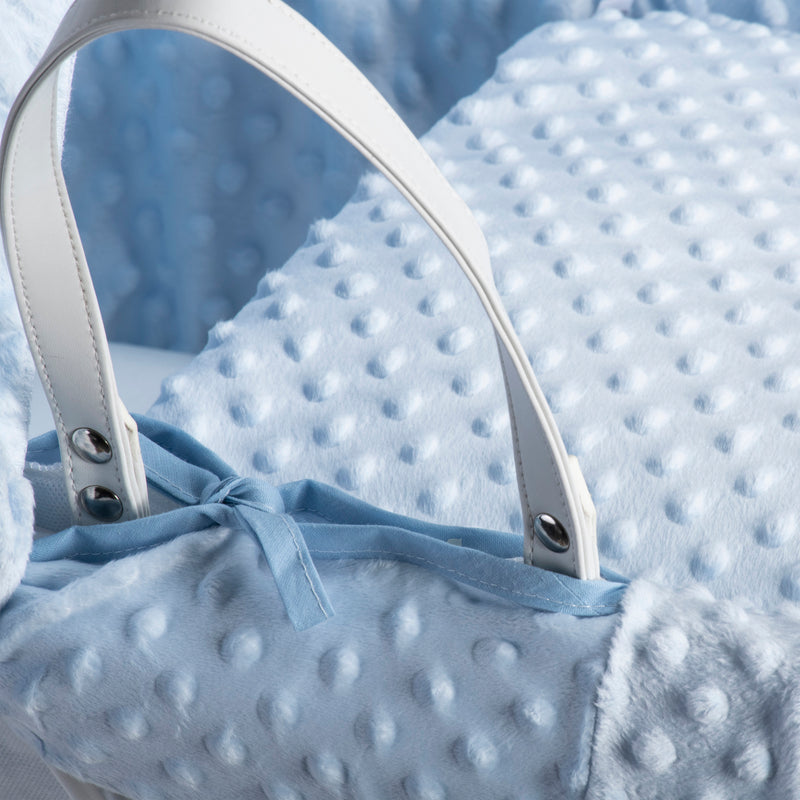 Blue Dimple White Wicker Moses Basket showing the vegan leather handle, matching coverlet and dressing with the breathable blue plush dimple fabrics | Moses Baskets | Co-sleepers | Nursery Furniture - Clair de Lune UK