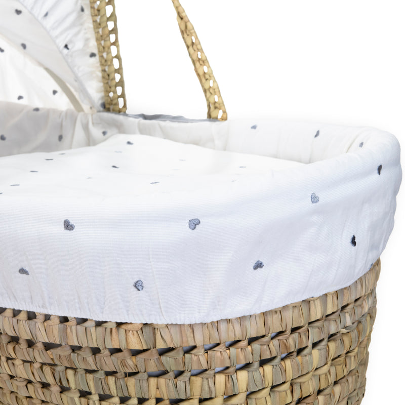 Lullaby Hearts Palm Moses Basket showcasing the delicately embroidered grey hearts on an ivory-white cotton Moses dressing and hood | Moses Baskets | Co-sleepers | Nursery Furniture - Clair de Lune UK