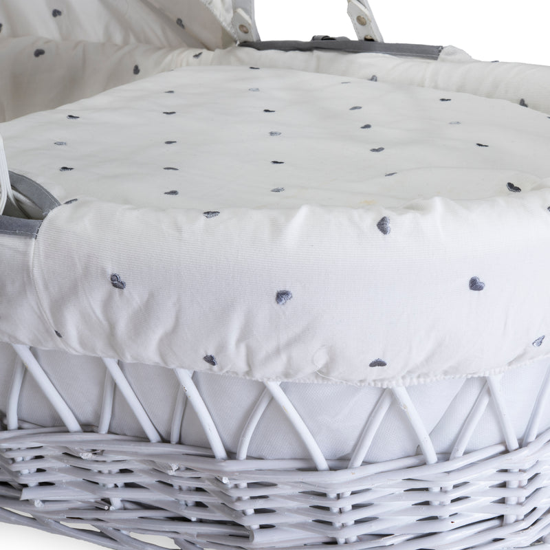 The embroidered hearts on the white fabrics of the Lullaby Hearts White Wicker Moses Basket | Moses Baskets | Co-sleepers | Nursery Furniture - Clair de Lune UK