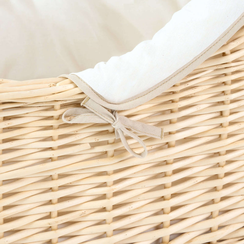 Cream Organic Natural Noah Pod with the cream organic dressing and sturdy natural wicker basket zoomed in with the bow detail | Bassinets | Nursery Furniture - Clair de Lune UK