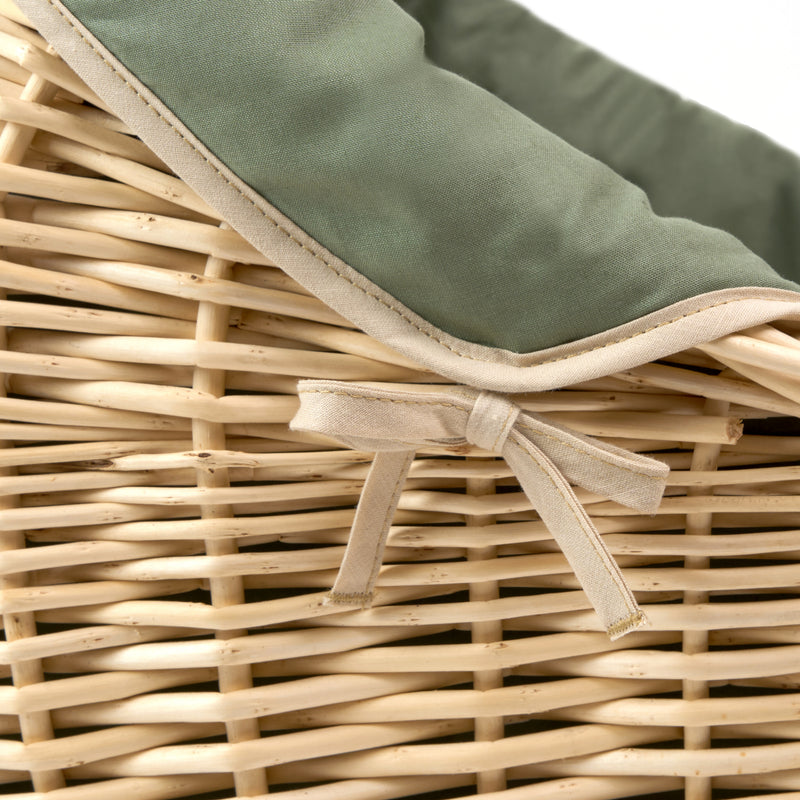  Forest Green Organic Natural Noah Pod with the green organic dressing and sturdy natural wicker basket zoomed in with the bow detail | Bassinets | Nursery Furniture - Clair de Lune UK